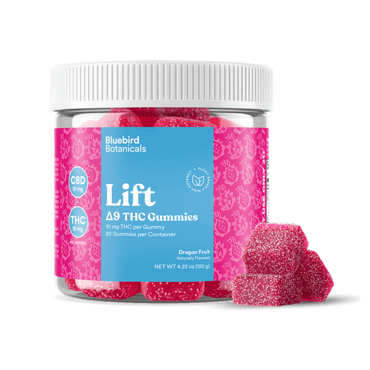 Jar of Bluebird Botanicals Lift Delta 9 THC Gummies with pink gummies on a black background.; Flavor: Dragon Fruit;