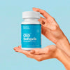 Hands displaying a bottle of Bluebird Botanicals 50 mg Broad Spectrum CBD Softgels.; Strength: 50 mg;