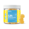 A clear plastic jar of Bluebird Botanicals Lift Lemon Delta-9 THC Gummies with a white ribbed cap and a bright blue and yellow label, shown next to three stacked yellow gummies on a black background.; Flavor: Lemon;