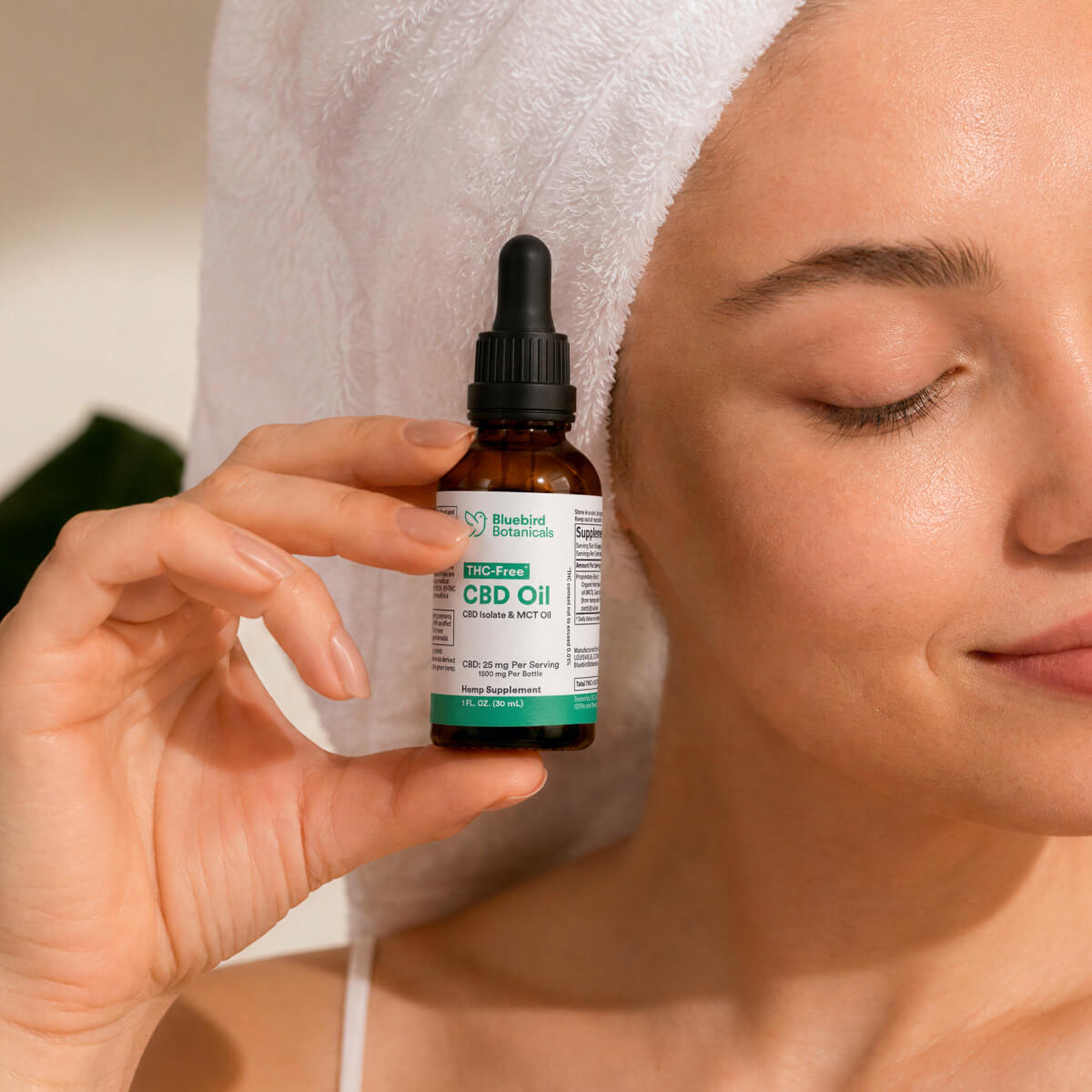 Woman with THC Free* CBD Oil Bluebird Botanicals